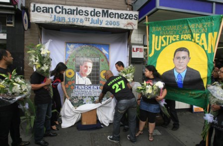 Friends and relatives of Jean Charles de Menezes including Erionaldo da Silva (left) and cousins Alex Pereira (second left), Vivian Figueiredo (third left), Alessandro Pereira (Centre) and Patricia da Silva Armani (centre right) launch a campaign to have a permanent memorial erected outside Stockwell Tube station in south London where he was shot dead by police four years ago to the day.